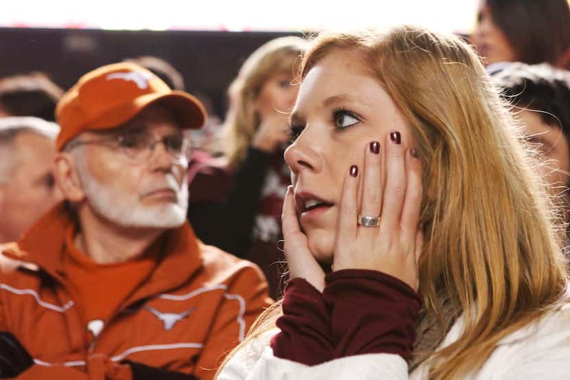 Aggie sophomore Stephanie Peterson of Dallas looks at the scoreboard during a tense moment...