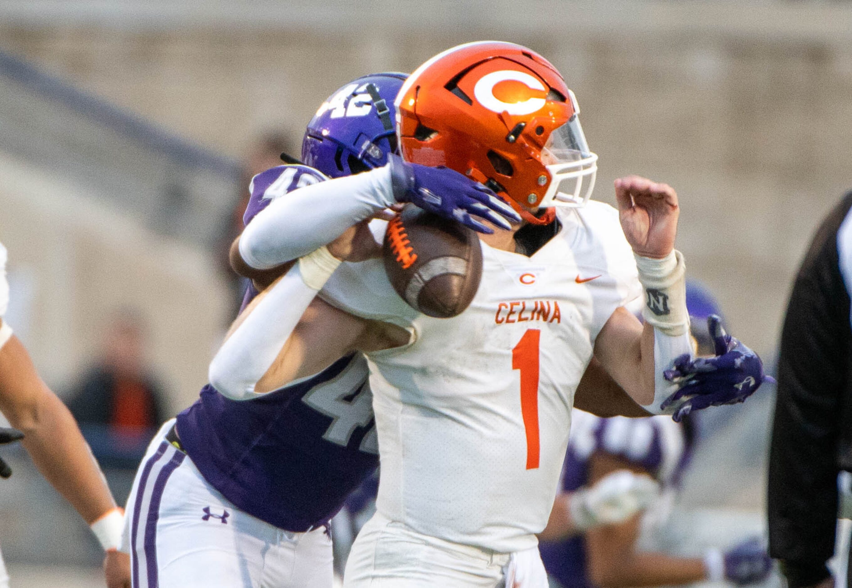 Anna’s outside linebacker Abram Greer (42) knocks the bal away from Celina quarterback Noah...