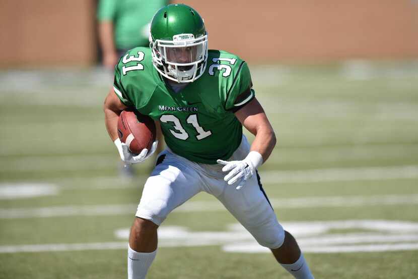 North Texas senior wide receiver Kenny Buyers (31) looks for space to run after making a...