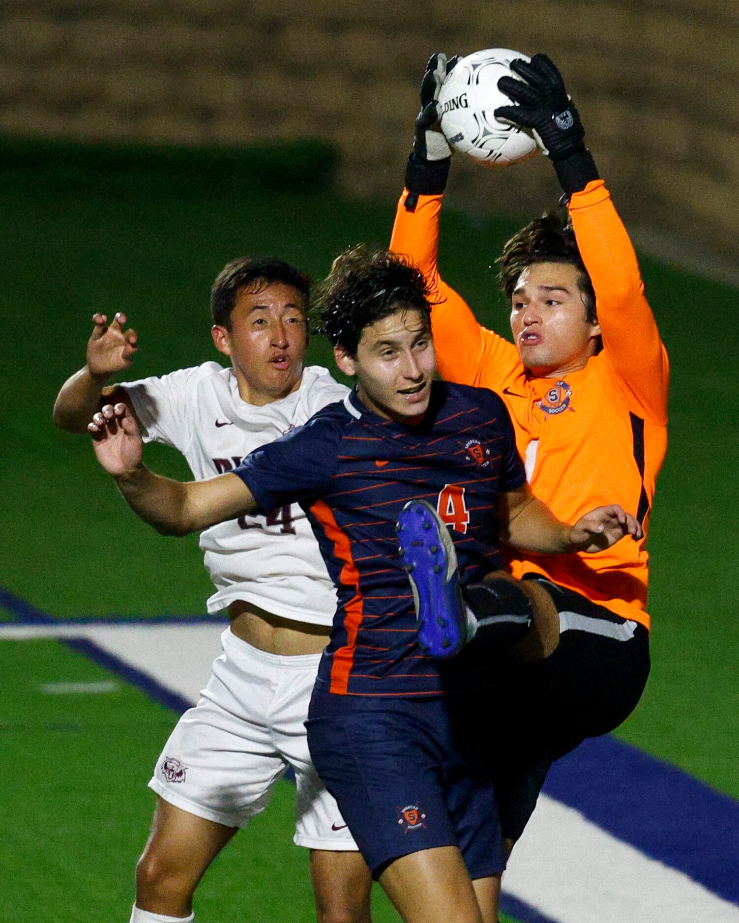 Katy Seven Lakes goalkeeper Anthony Gonzalez (1) catches the ball over Plano midfielder...