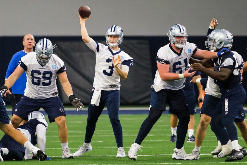 Dallas Cowboys quarterback Mike White (3) throws a pass during a team OTA practice at The...