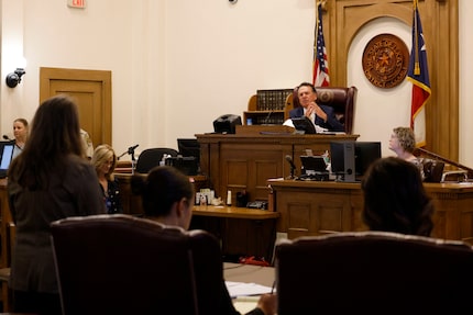 Judge Alfonso Charles speaks to Robert Roberson’s attorney Gretchen Sims Sween, far left,...