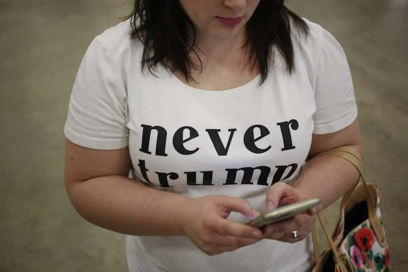  A woman made her political opinion known in a "Never Trump" shirt during a campaign event...