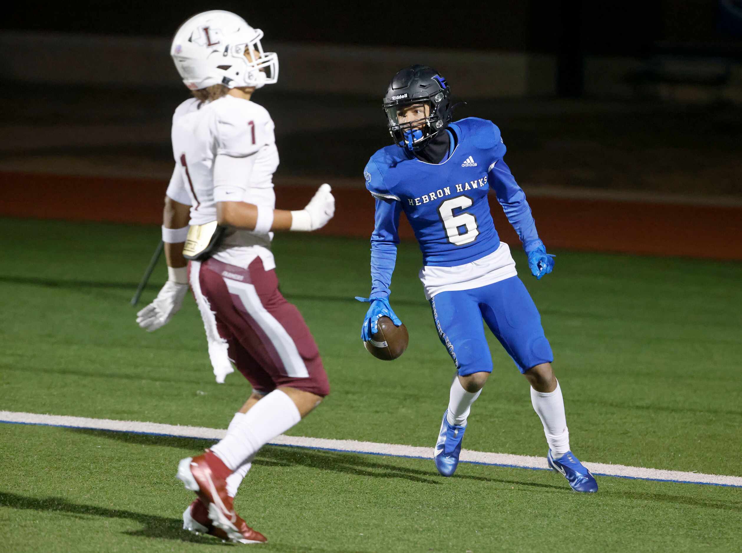 Hebron’s Takoda Bridges (6) celebrates his reception for a touchdown in front of...