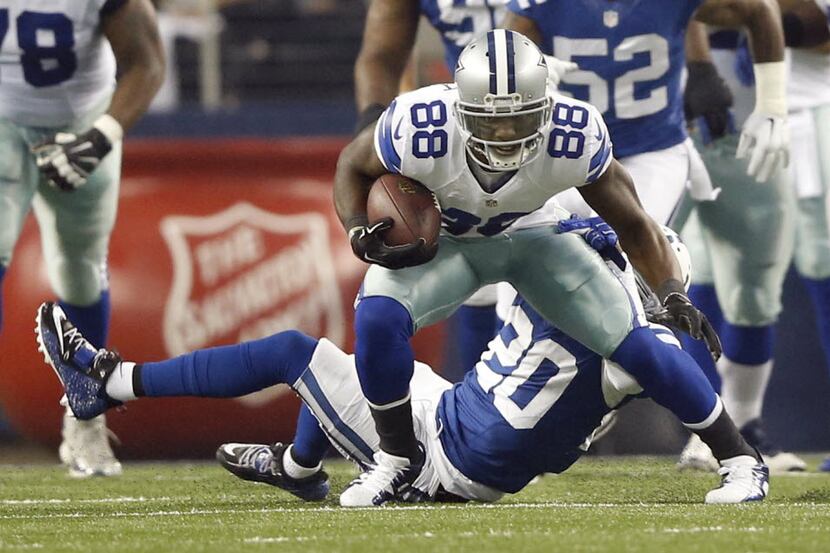 Dallas Cowboys wide receiver Dez Bryant (88) attempts to shake Indianapolis Colts cornerback...