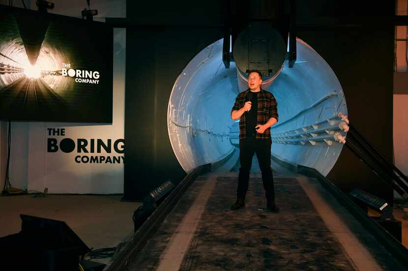 Elon Musk speaks to the media during a 2018 unveiling event for the Boring Co.'s test tunnel...
