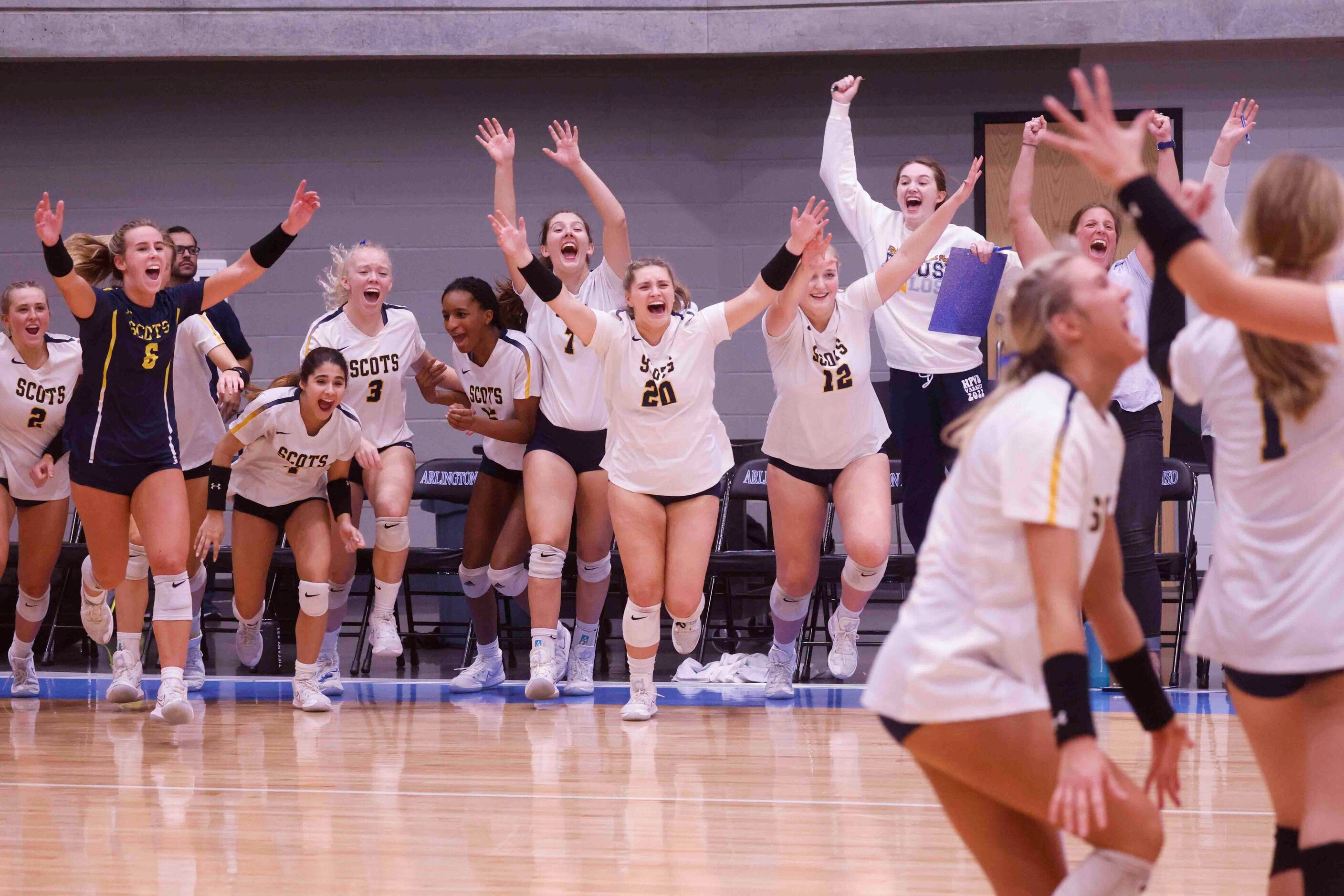 Highland Park players celebrate after winning against Flower Mound during a volleyball game...