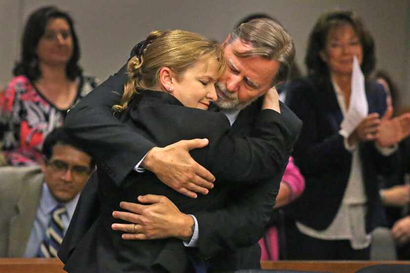 Former Judge Suzanne Wooten embraced her husband Wes Wayland after her 2011 convictions were...