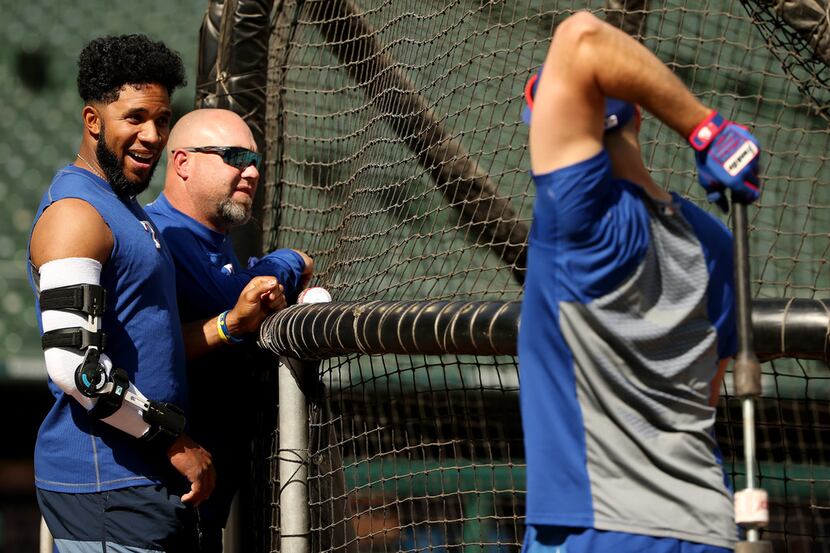 Texas Rangers shortstop Elvis Andrus (1) talks to a teammate during batting practice before...