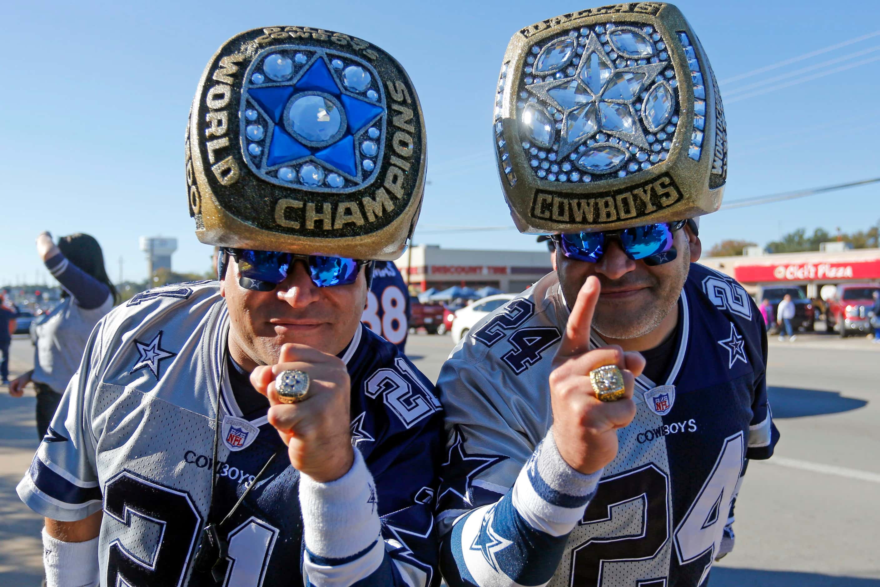 Christopher and Steven Saucedo, of San Angelo, TX, show off their homemade Super Bowl rings...