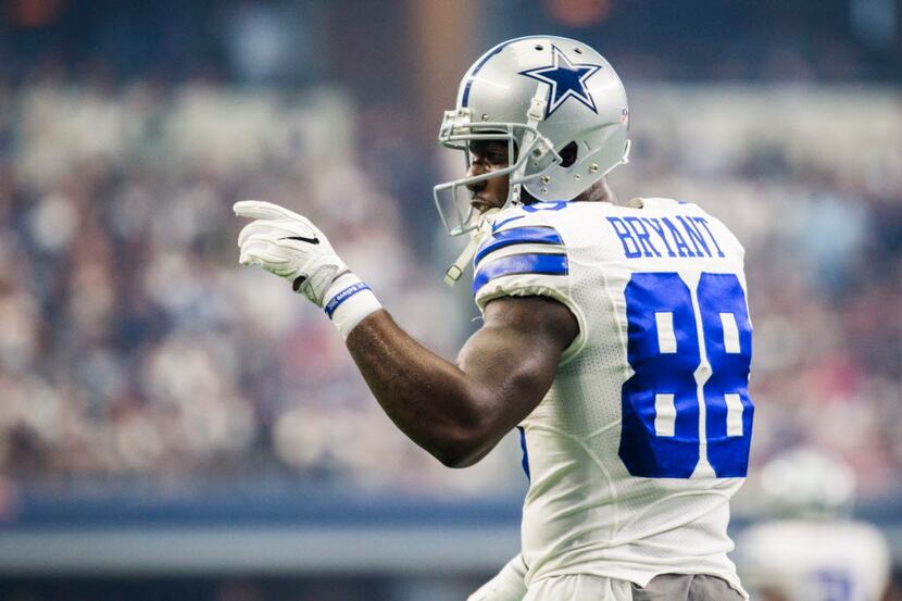 Dallas Cowboys wide receiver Dez Bryant (88) points to the sideline during the first quarter...