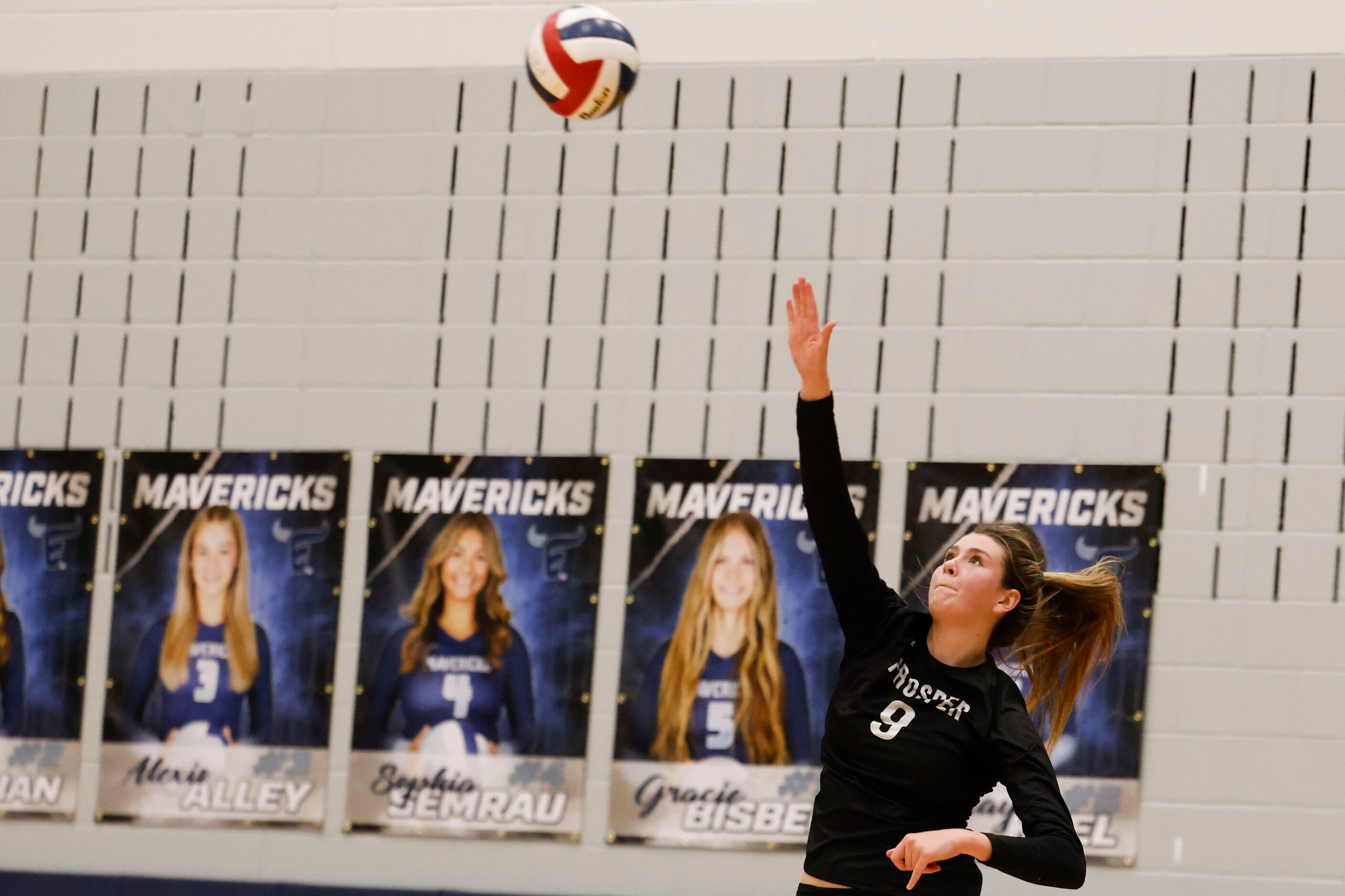 Prosper high’s Ayden Ames serves against Plano West during class 6A bi-district volleyball...