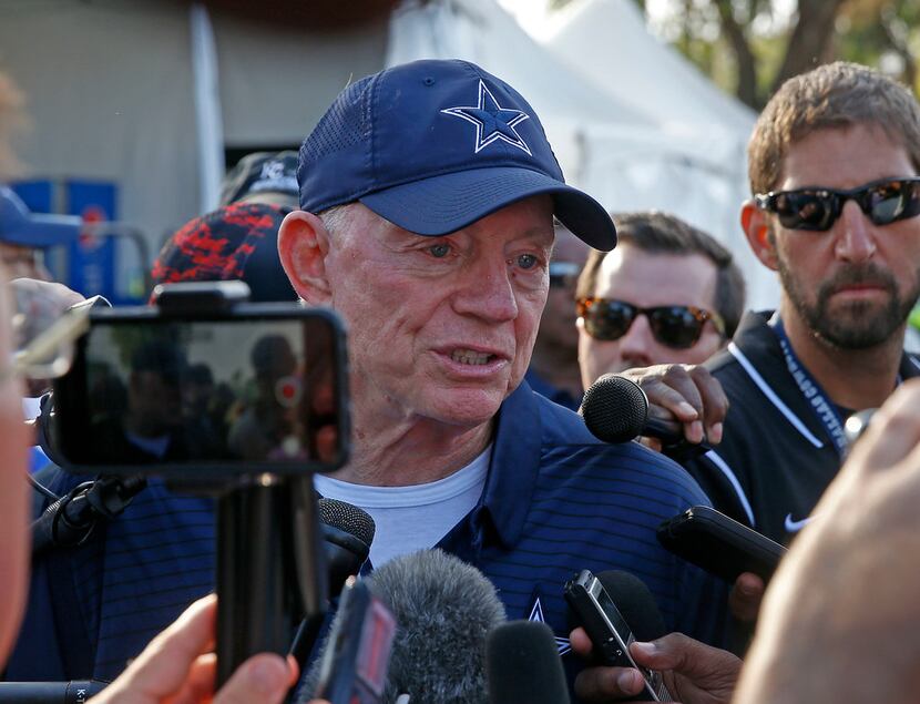 Dallas Cowboys owner Jerry Jones talks with the media after practice at training camp in...
