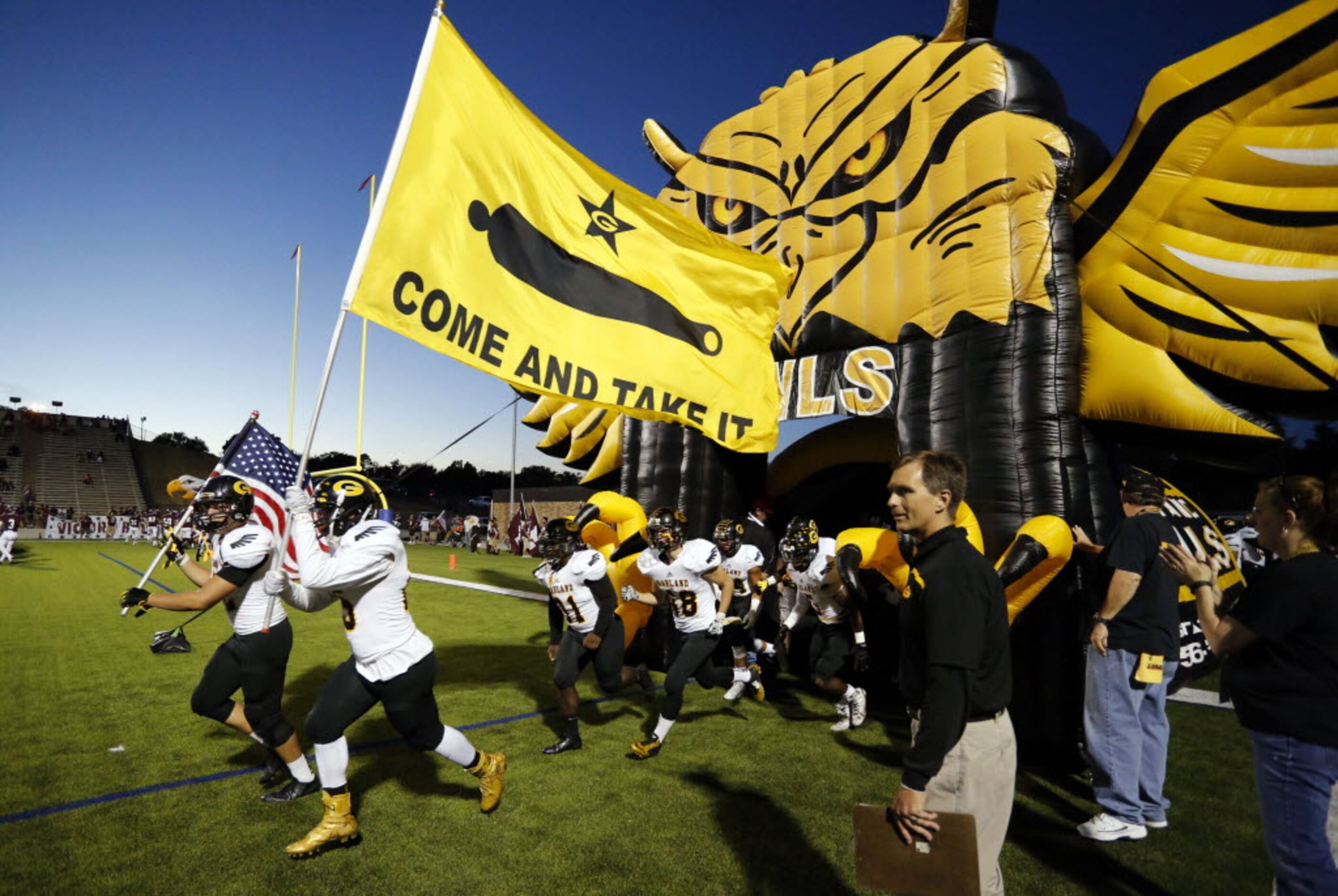 (TXHSFB) The Garland Owls take the field before the start of a high school football game...