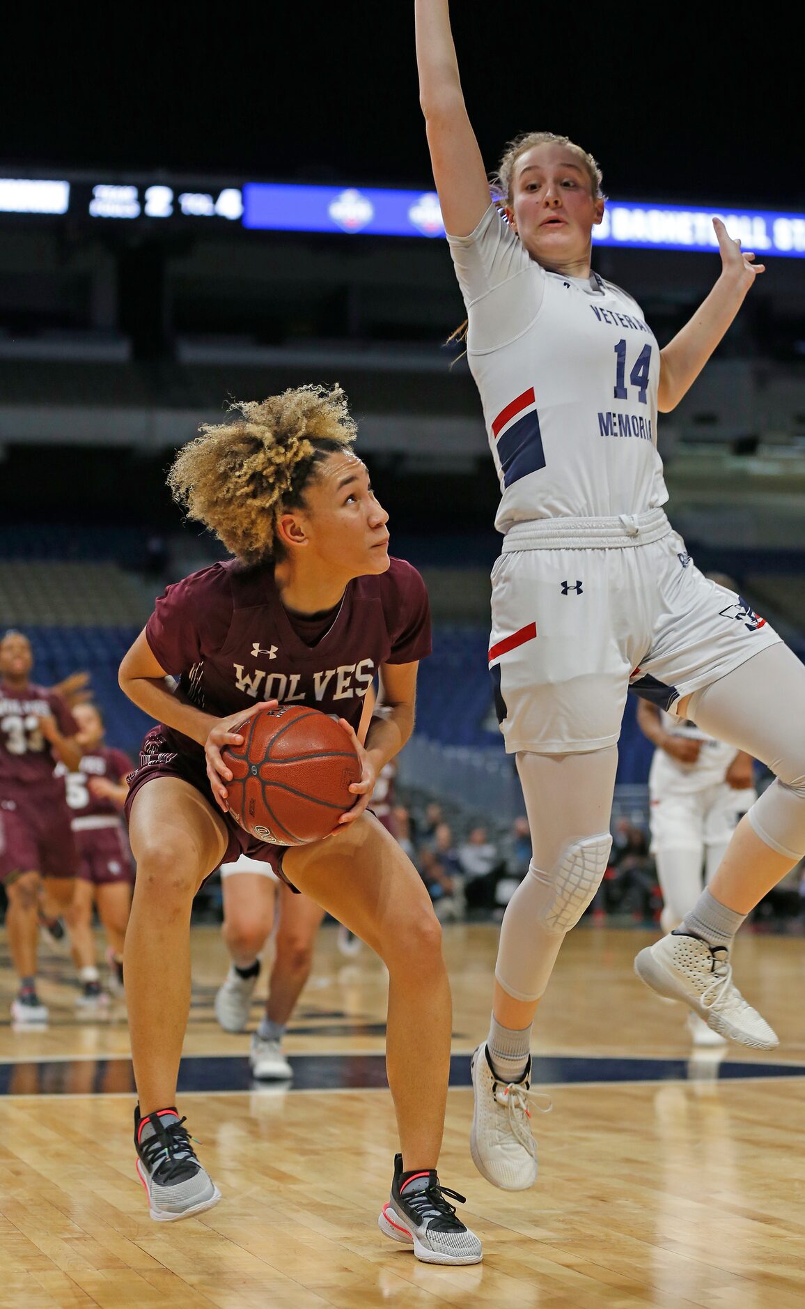 Veterans Memorial guard Breanna Perez #14 forces Mansfield Timberview guard Jasmynne Brown...