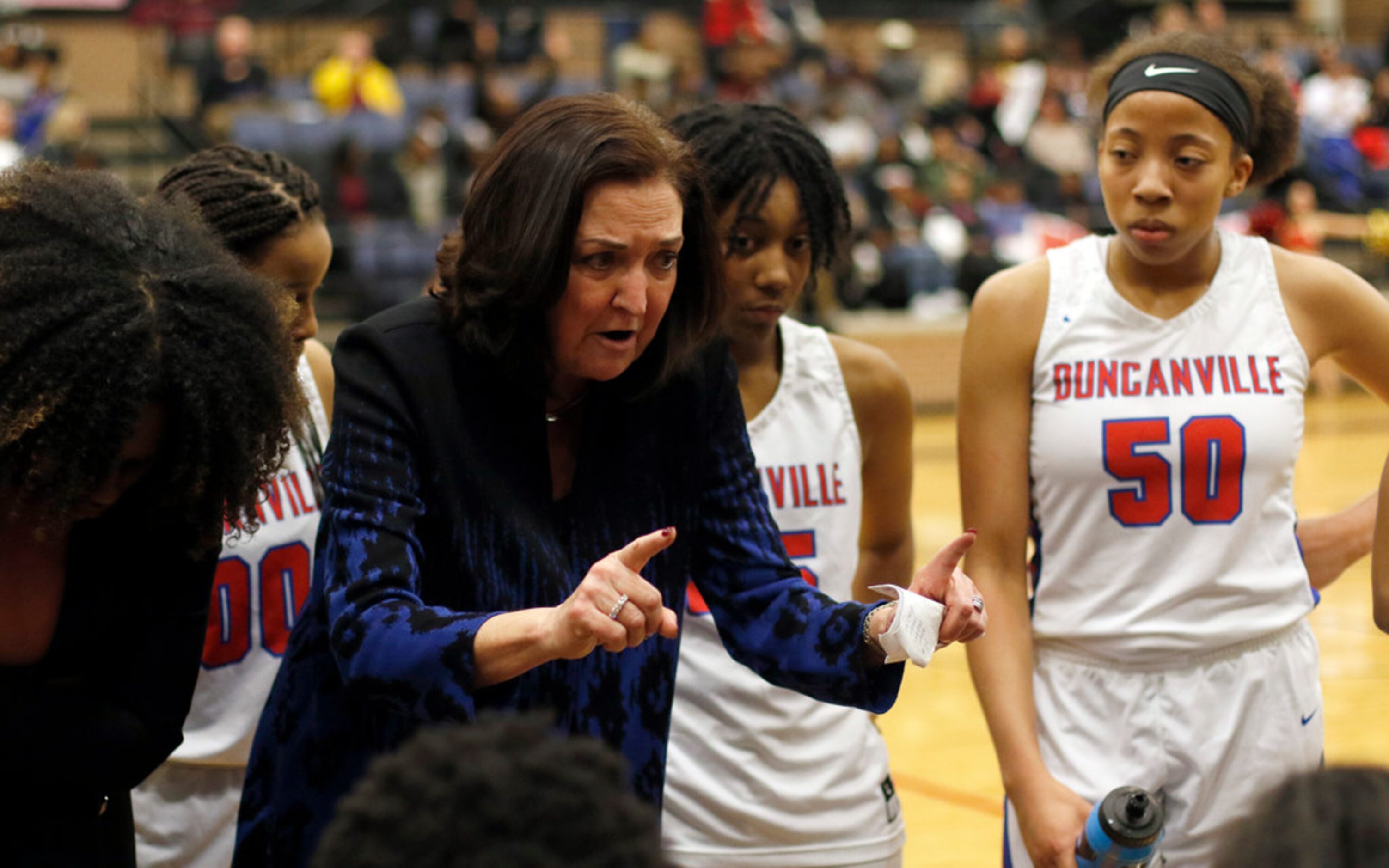 Duncanville head coach Cathy Self-Morgan speaks with her players during a timeout in the...