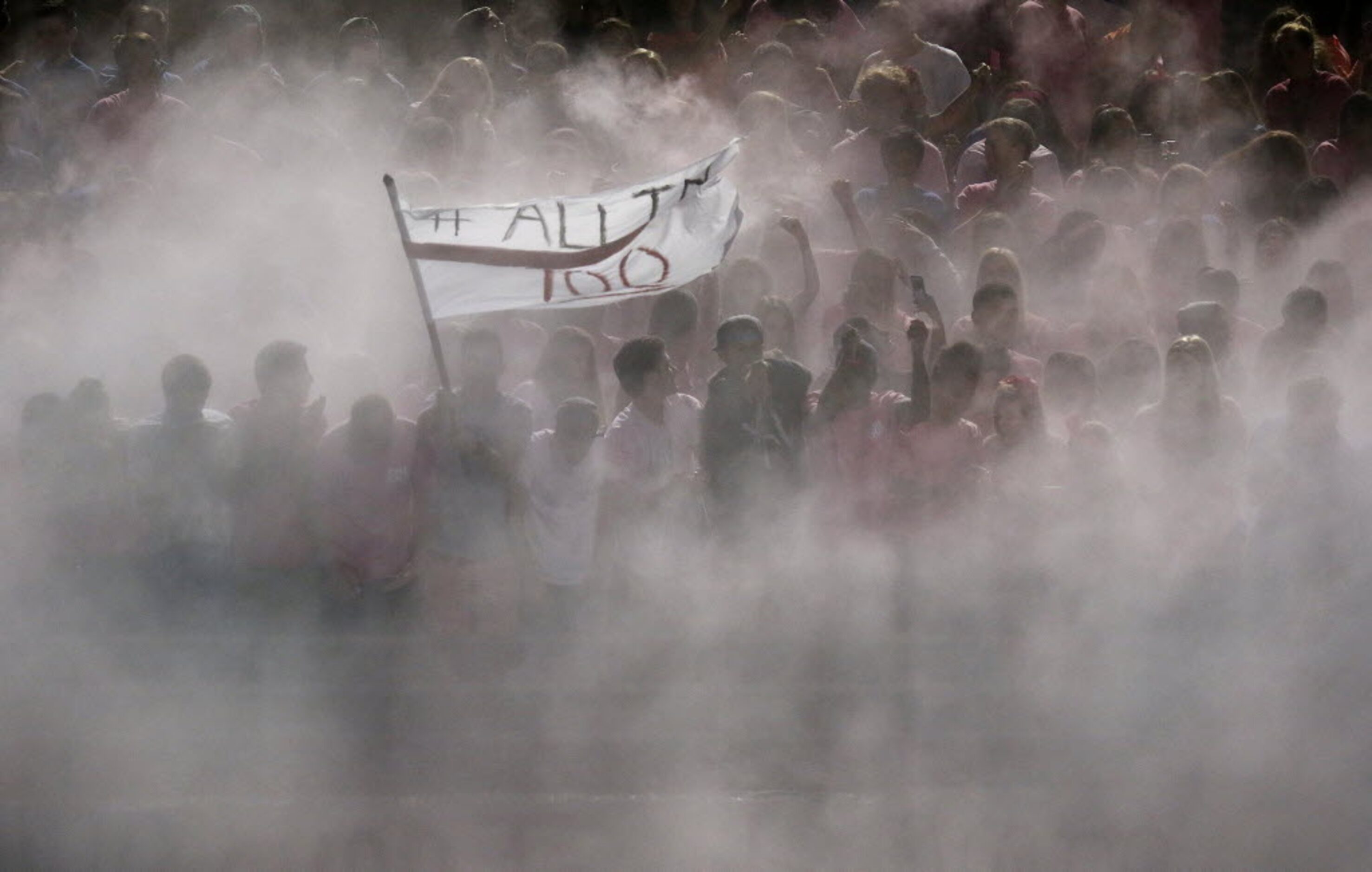 The Plano West High School student section is covered by a blanket of chalk which they threw...