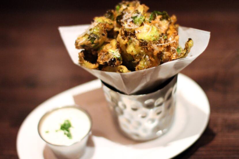 Tempura brussels sprouts leaves are accented with a whole grain mustard aioli.