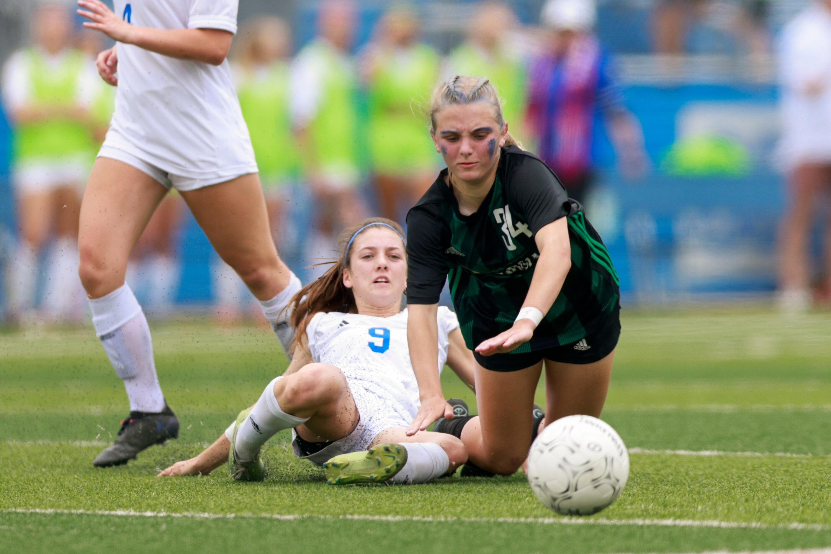 Austin Westlake defender Kaitlin Ogilvie (9) tackles Southlake Carroll midfielder Hannah...