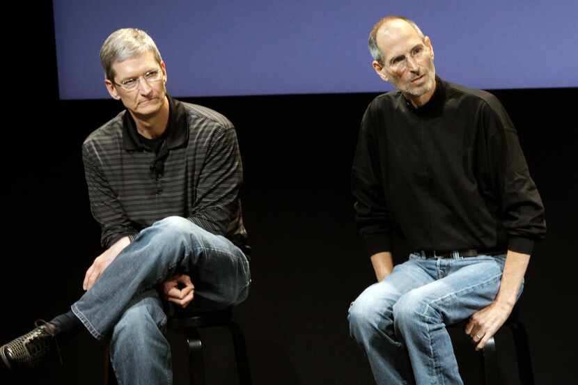 FILE - This July 16, 2010 photo shows Apple's Tim Cook, left, and Steve Jobs, right, during...