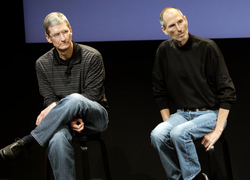 FILE - This July 16, 2010 photo shows Apple's Tim Cook, left, and Steve Jobs, right, during...
