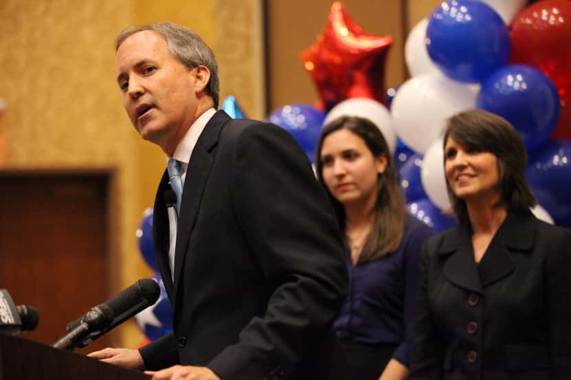 Ken Paxton stands with his family after winning the Republican primary for Texas attorney...