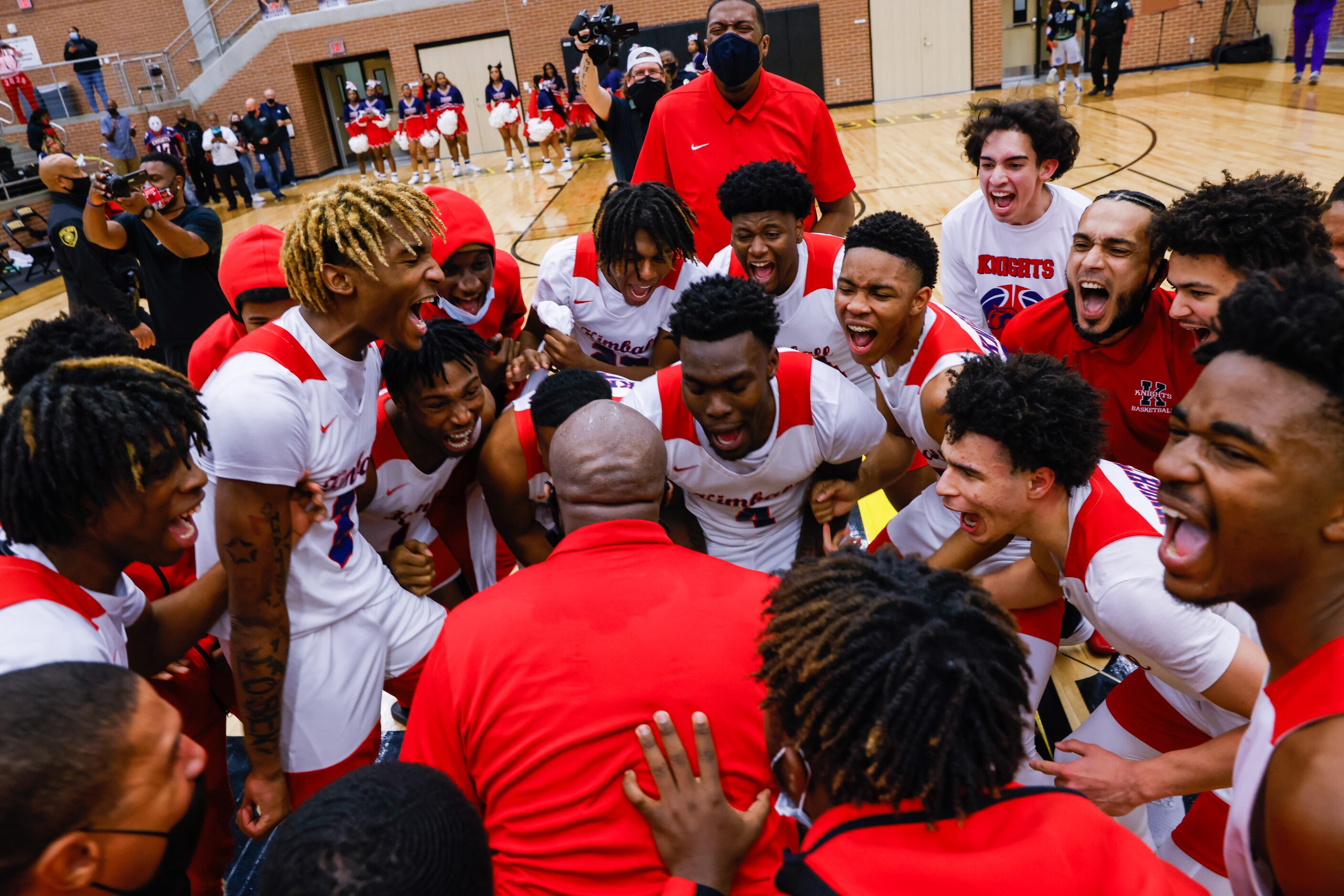 Kimball celebrates their win over Lancaster following overtime of a boys basketball UIL...