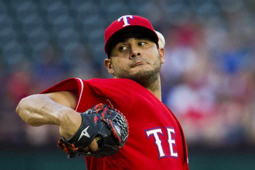 Texas Rangers starting pitcher Martin Perez (33) pitches during the first inning of their...