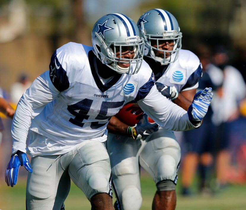 Dallas Cowboys running back Rod Smith (45) blocks for running back Alfred Morris (46) during...