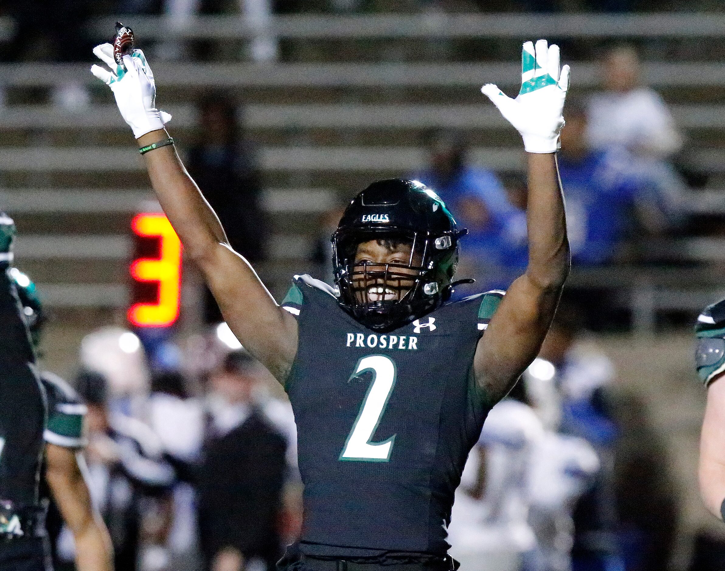 Prosper High School defensive back Kaleb Miles (2) celebrates his interception during the...