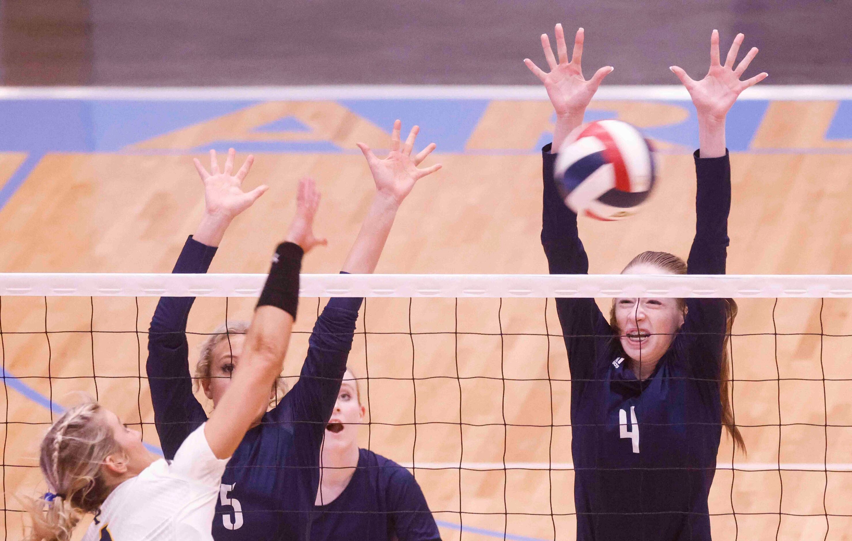 Flower Mound’s Audrey DeJesus (5) and Caroline Tredwell (4) blocks against Highland Park...