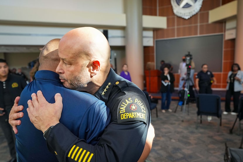 Dallas Police Chief Eddie Garcia hugs Dallas Police Association president Jaime Castro after...