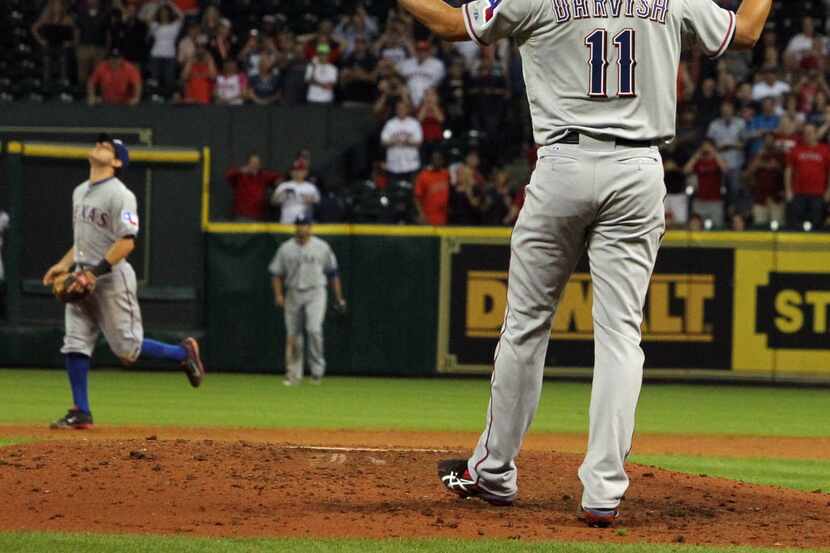 Yu Darvish reacts after Marwin Gonzalez' hit as he loses his perfect game and no-hitter with...