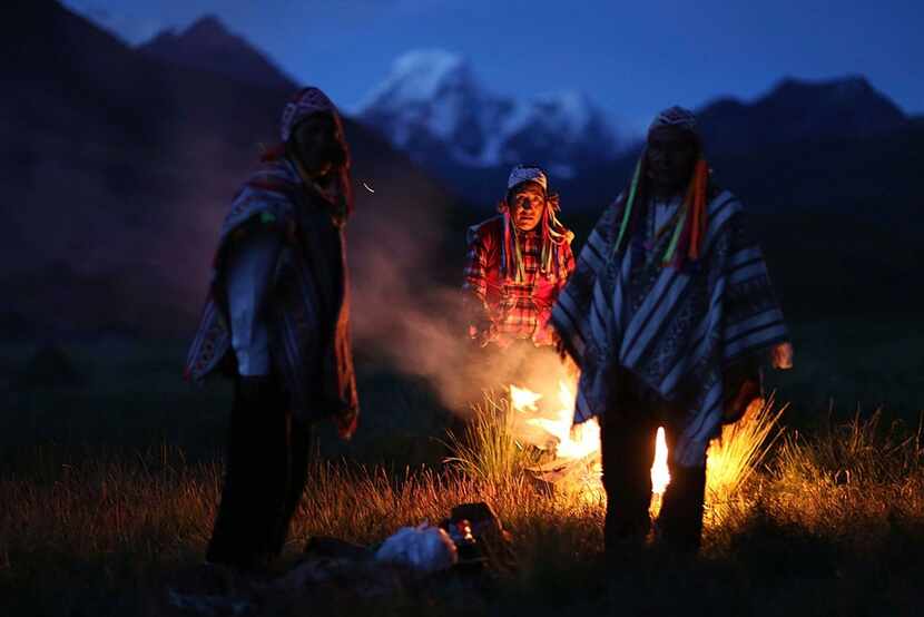 Andean farmers take part in a ceremony honoring Mother Earth and Father Snowy Mountain, in...