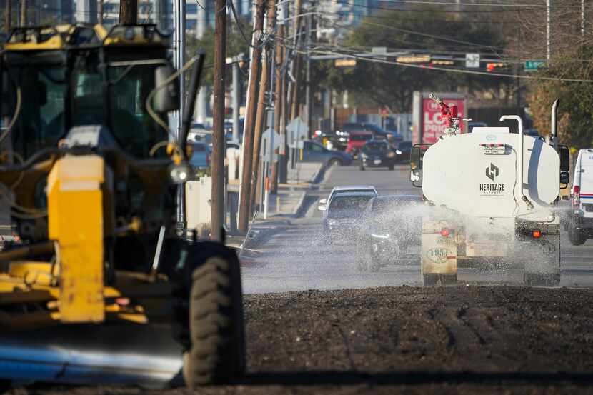 Crews work on a street resurfacing project in northeast Dallas on Tuesday, Feb. 15, 2022,
