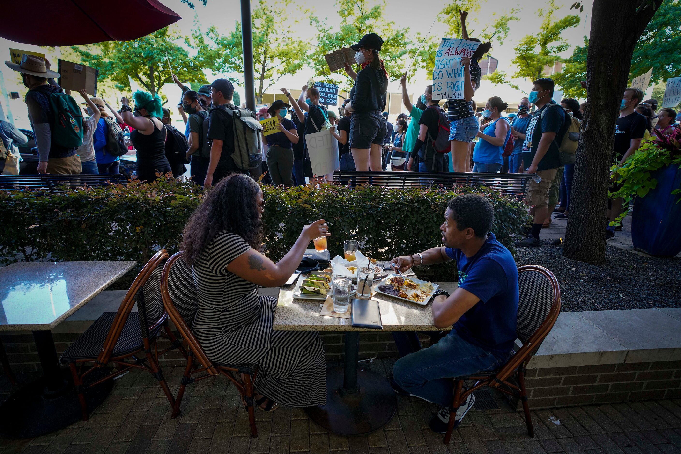 A couple eats dinner at Gloria's Latin Cuisine at the corner of Lemmon Avenue and Carlisle...