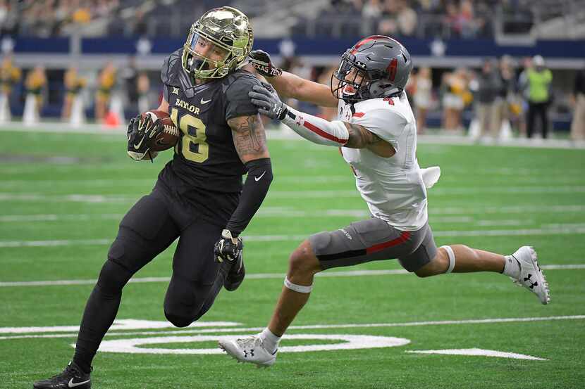 Baylor Bears wide receiver Gavin Holmes (18) outruns Texas Tech Red Raiders defensive back...