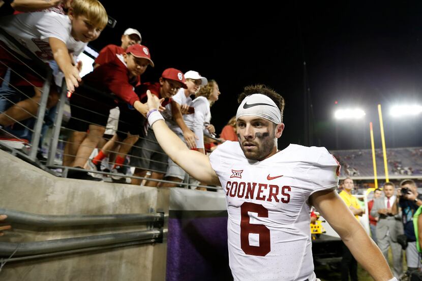 Oklahoma quarterback Baker Mayfield walks off the field after a 52-46 win over TCU at Amon...