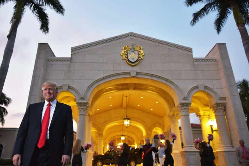 US President Donald Trump watches the Palm Beach Central High School marching band perform...