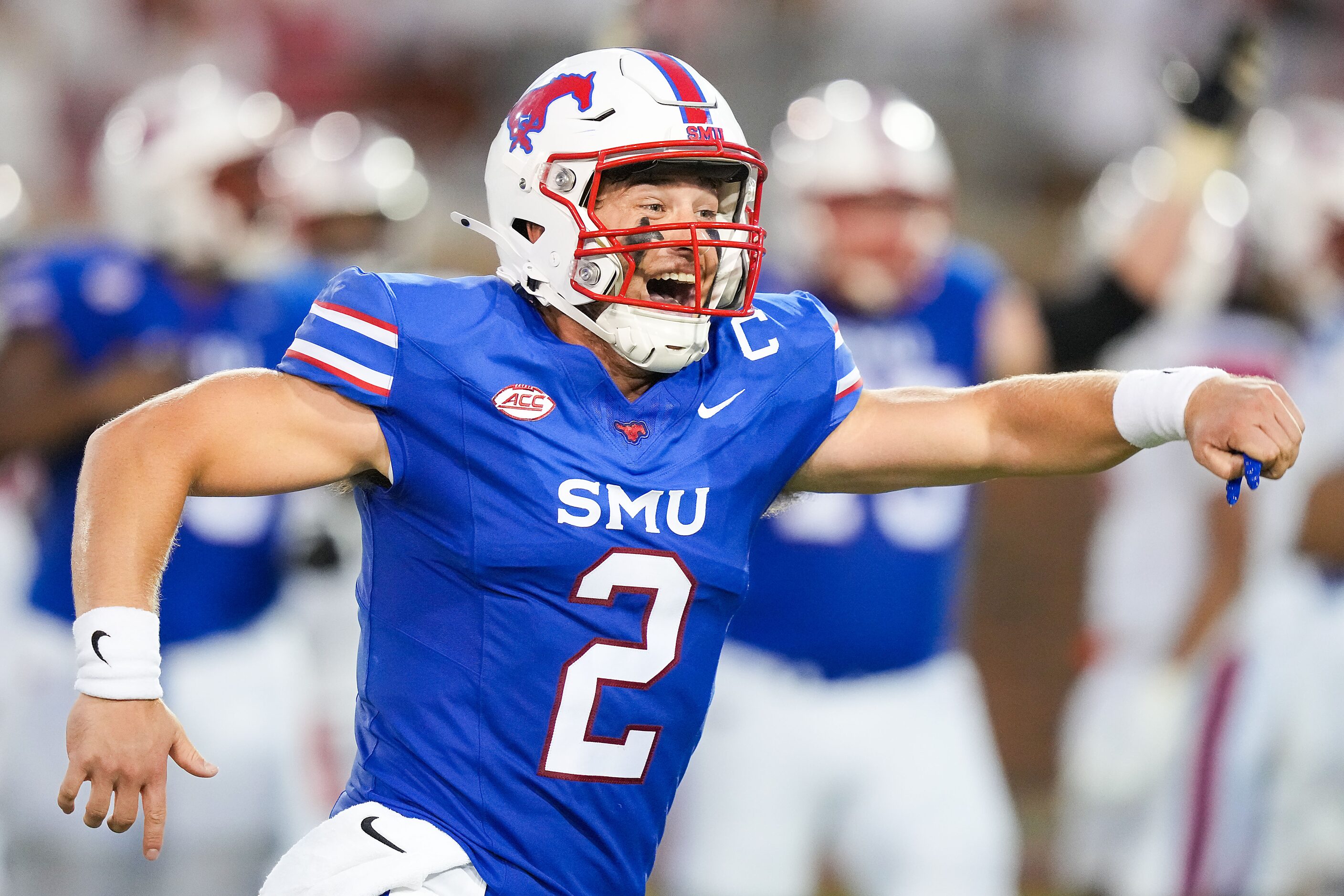 SMU quarterback Preston Stone celebrates after throwing a touchdown pass to wide receiver...