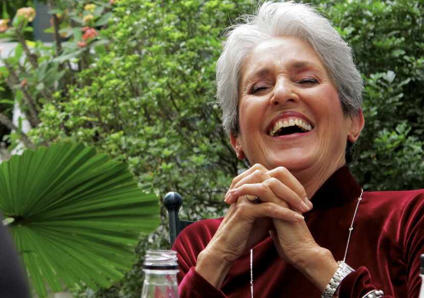 In this April 6, 2013 photo, Joan Baez laughs while speaking to former staff at the...