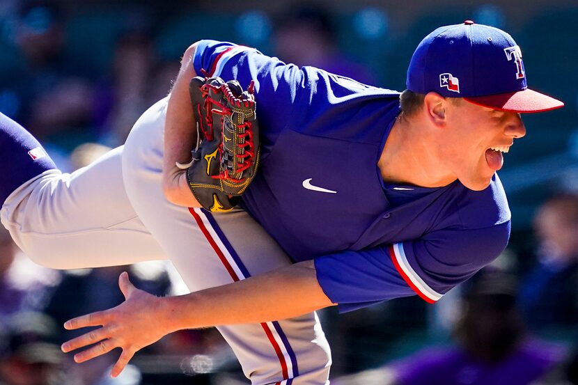 Texas Rangers pitcher Kolby Allard follows through on a pitch  during the first inning of a...