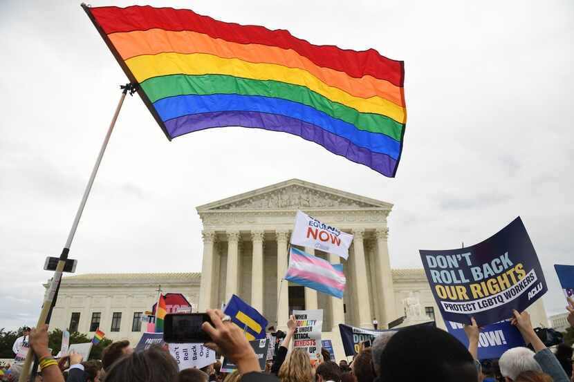 Demonstrators in favor of LGBT rights rally outside the US Supreme Court in Washington, DC,...