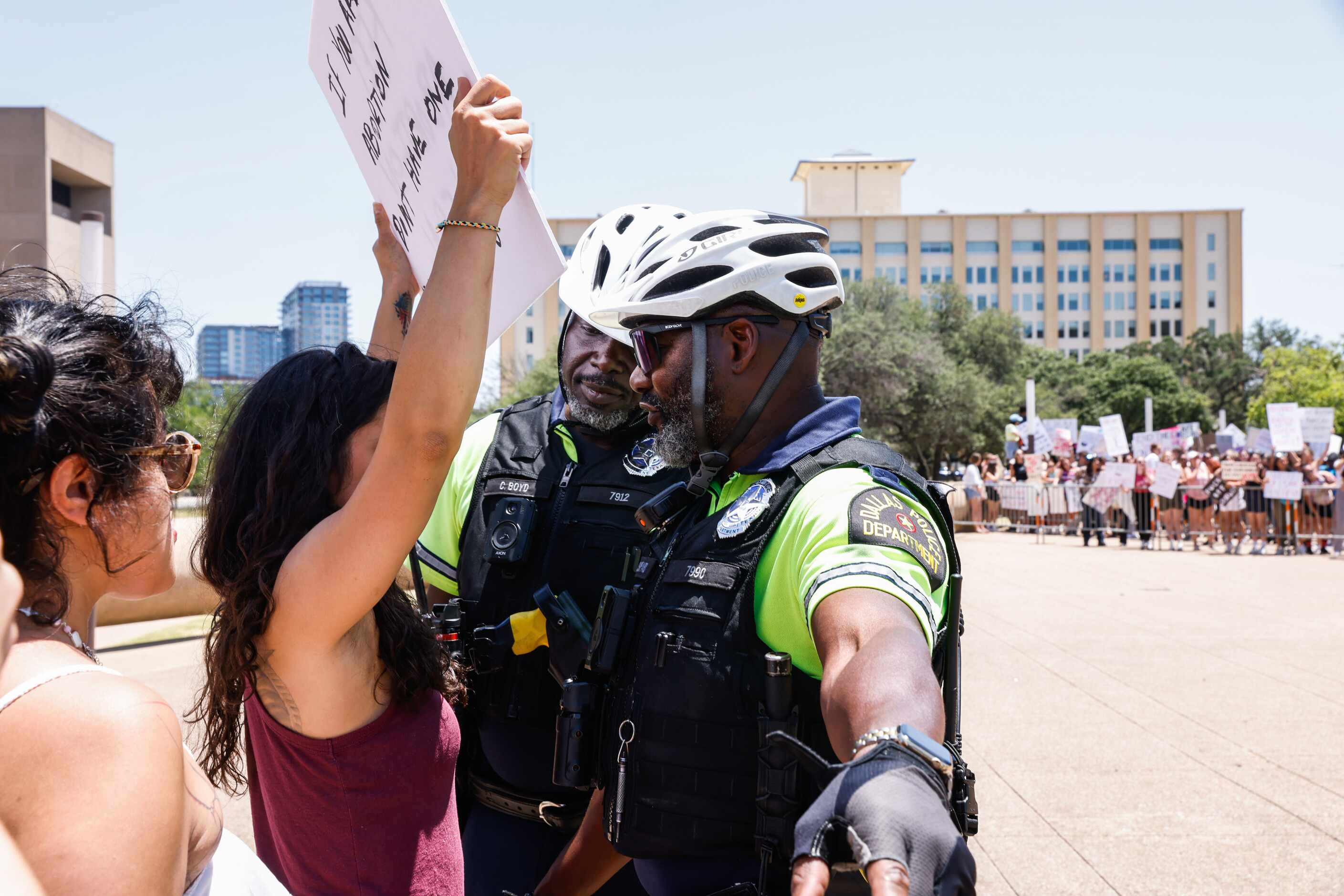 Dallas Police officers gets into argument with an abortion rights supporter during a protest...