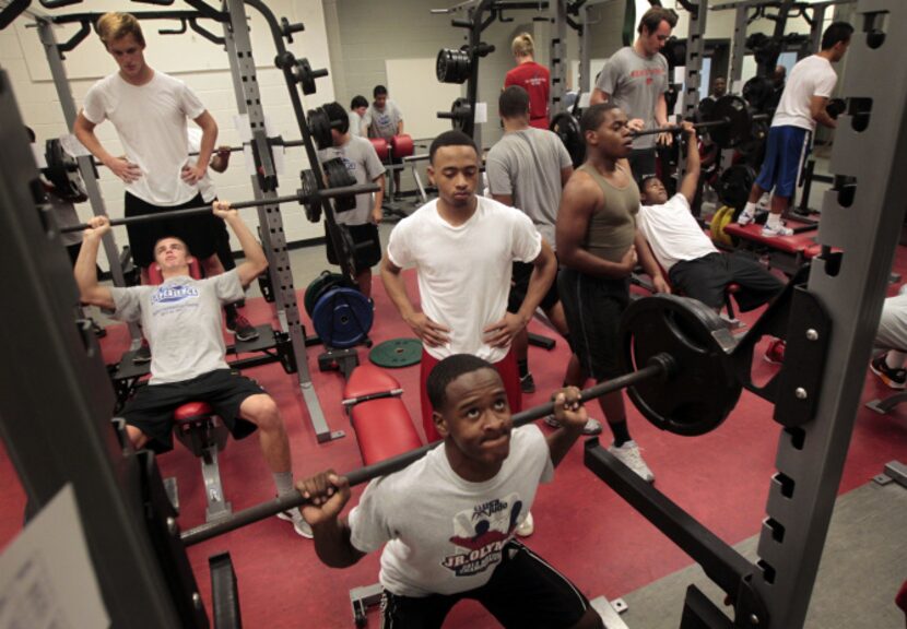 Montray Roberts, a deaf varsity football player at Woodrow Wilson High School, spots spots...