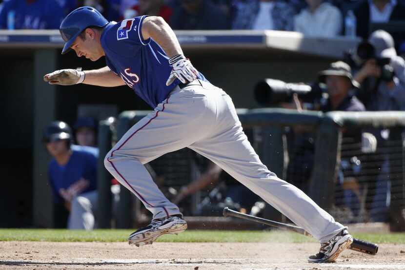 Texas Rangers outfielder Jared Hoying runs out a base hit in the first inning during a Major...