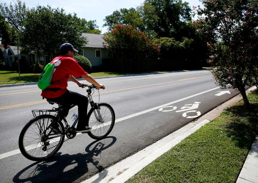 Felipe Garcia rides down a bike lane on Matilda Street in Dallas.