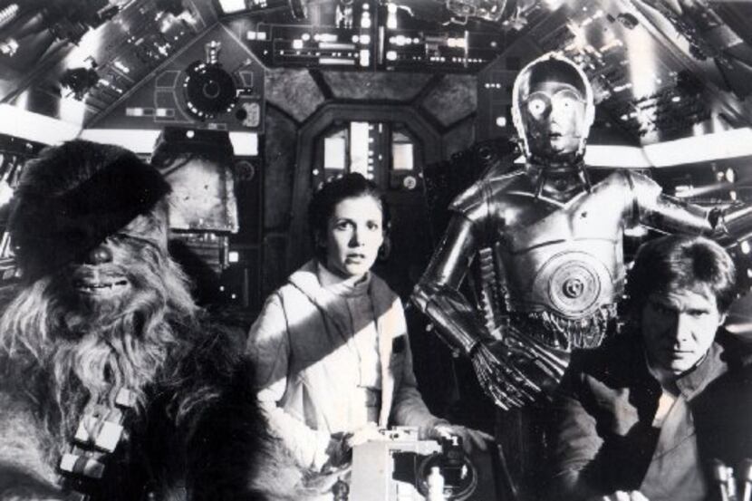 Chewbacca (Peter Mahyew), Princess Leia (Carrie Fisher), C-3PO (Anthony Daniels) and Han...
