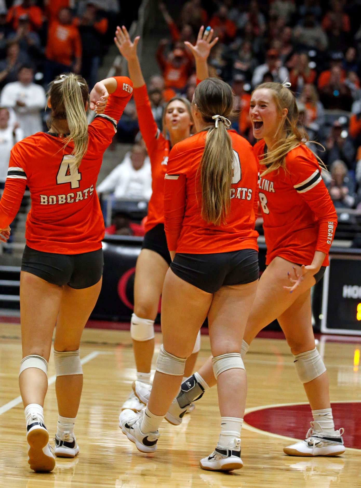 Celina teammates, including Payton Grubbs (8) celebrate a blocked shot during the Class 4A...