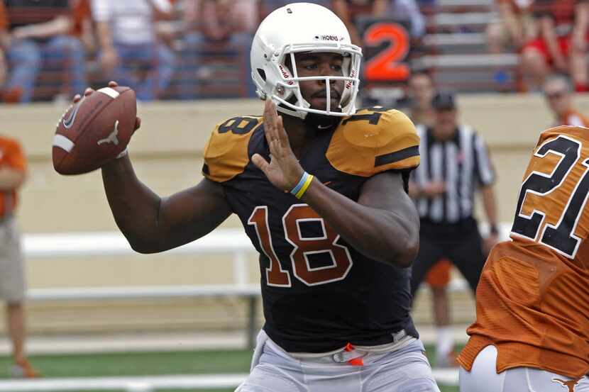 Texas quarterback Tyrone Swoopes (18) looks to throw during the first quarter of Texas'...